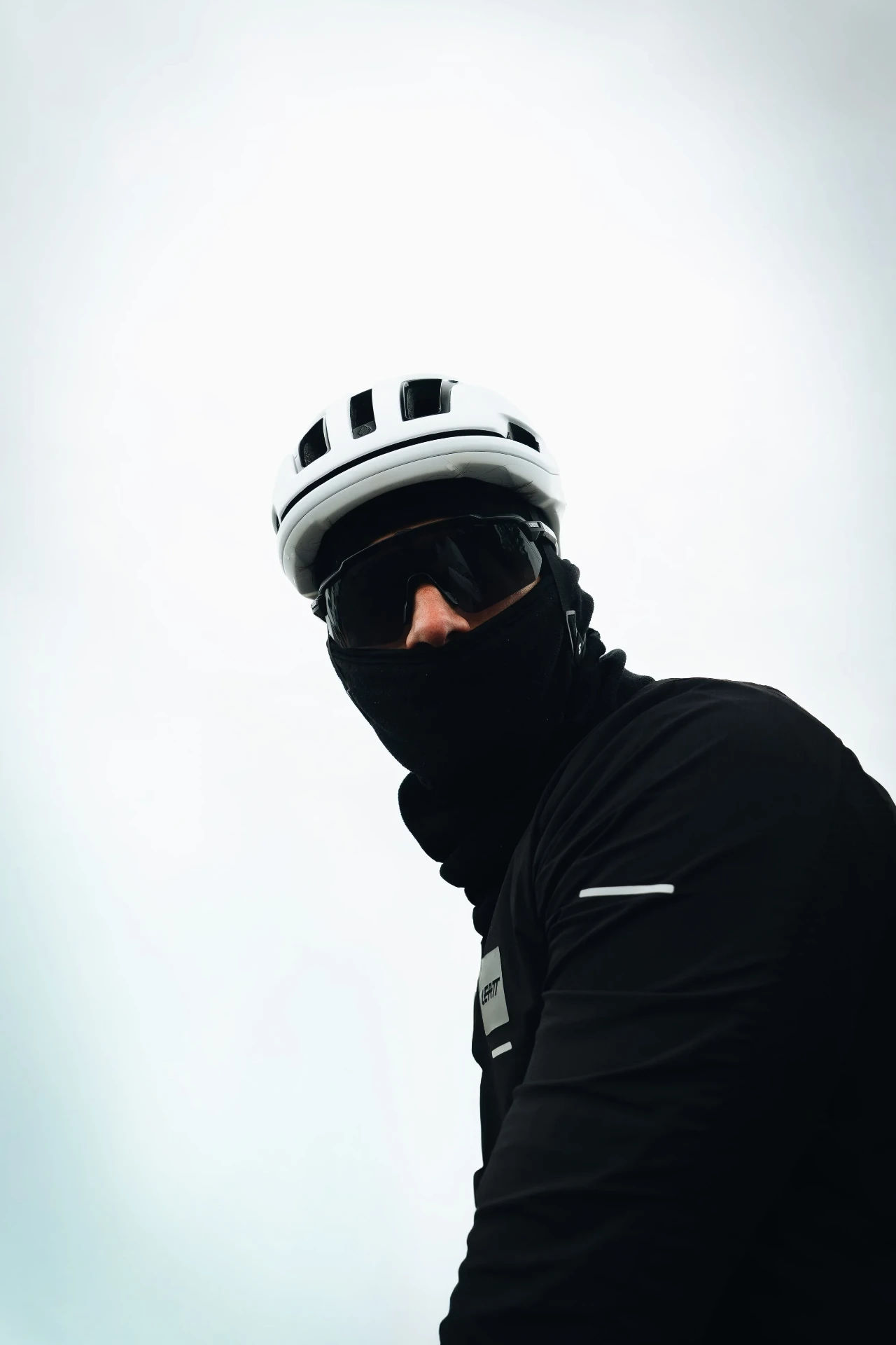 Cyclist portrait wearing a helmet and winter clothing