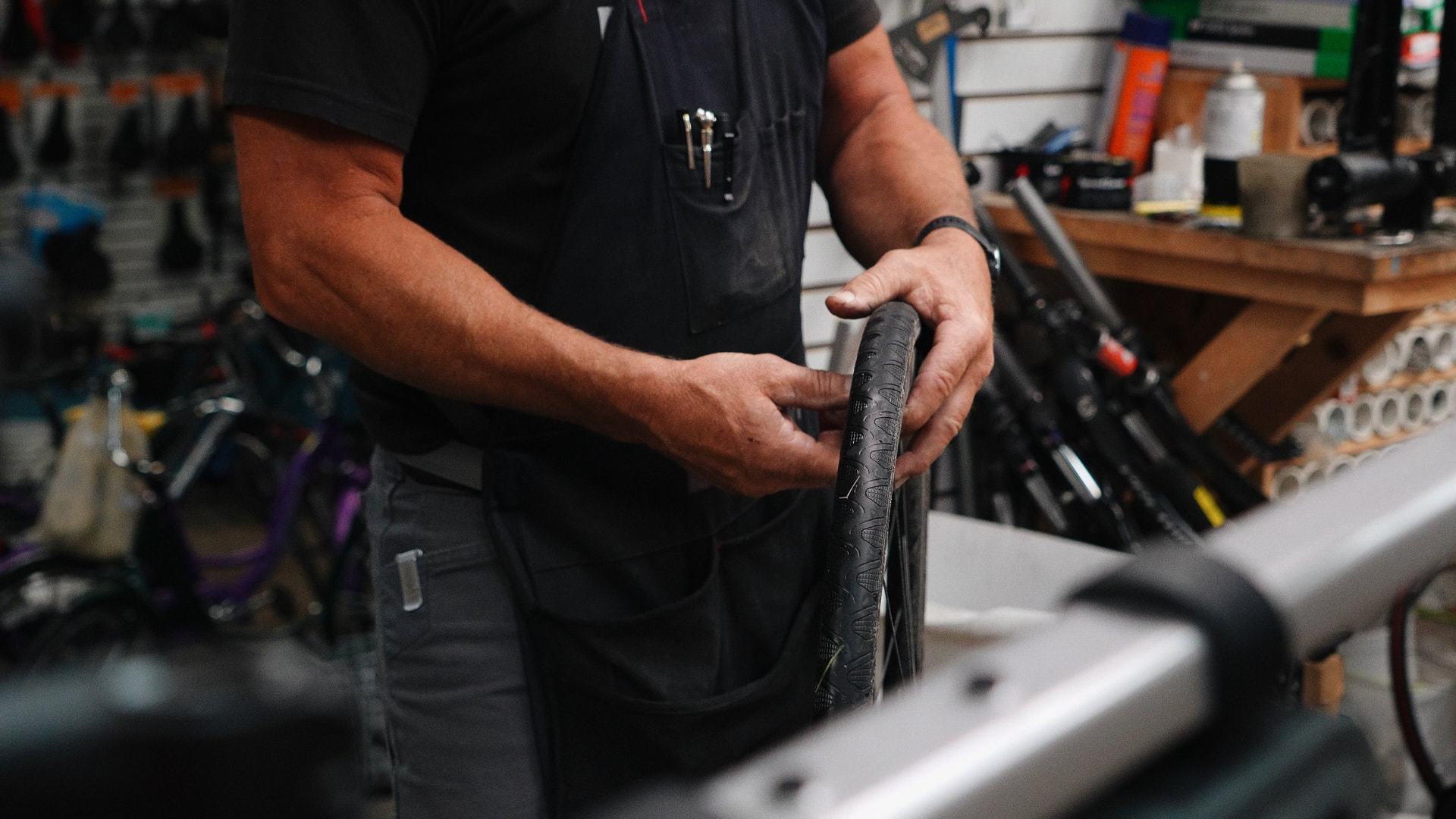 Mechanic hands working on a bicycle tire