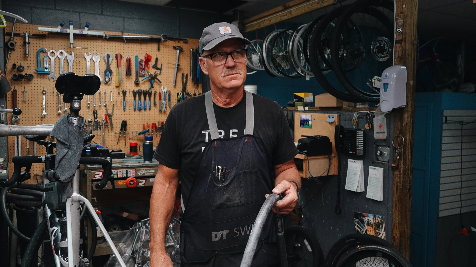 Bike mechanic standing in his workshop